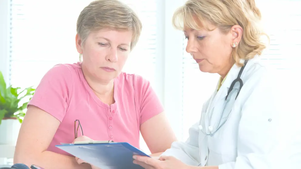 Female patient discussing treatment plans with female doctor