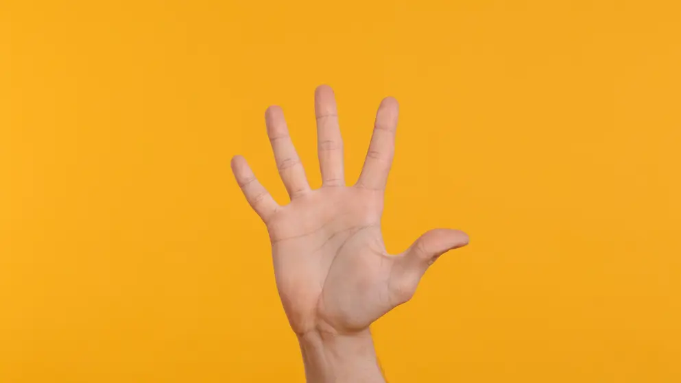 Waving hello on a yellow background